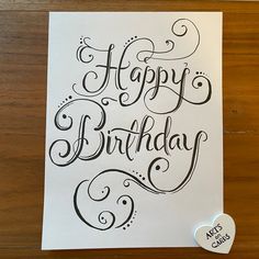 a card with the words happy birthday written in cursive writing and a heart