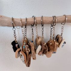 several pairs of shoes hanging from a wooden rack