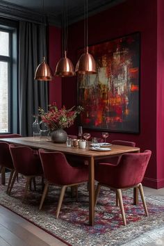 a dining room with red chairs and a table in front of a large painting on the wall