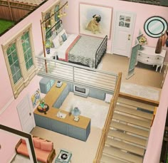 an aerial view of a bedroom and living room in a doll house with stairs leading up to the second floor