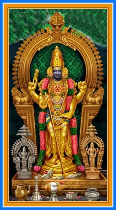 a golden statue sitting on top of a blue and yellow frame with other items around it