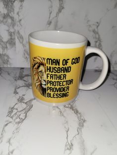 a yellow and white coffee mug with the words man of god husband father protector prayer