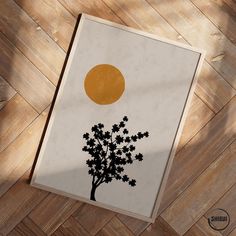 an image of a tree with the sun in the background on a wooden floor,