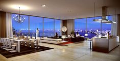 a living room filled with furniture and large windows overlooking the city at night in front of them