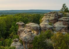 some very pretty rocks with trees in the background