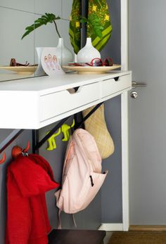 there is a shelf with hats and purses on it