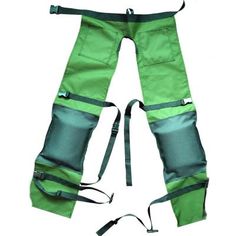 a pair of green pants with straps on the bottom and one leg in the middle