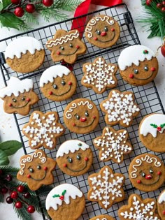 gingerbread cookies decorated with icing on a cooling rack