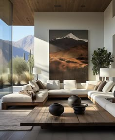 a living room filled with furniture and a painting on the wall