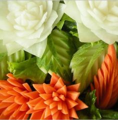 some white and orange flowers with green leaves