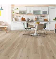 an image of a kitchen setting with wood flooring and white cabinets in the background