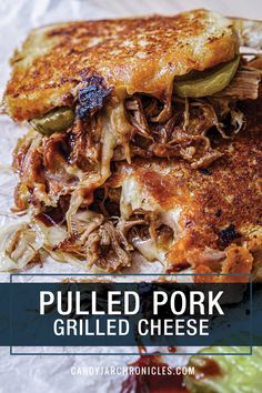 pulled pork grilled cheese sandwich with pickles on the side and text overlay reading pulled pork grilled cheese