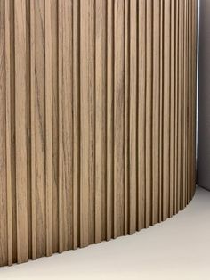 a wooden wall with vertical slats on it