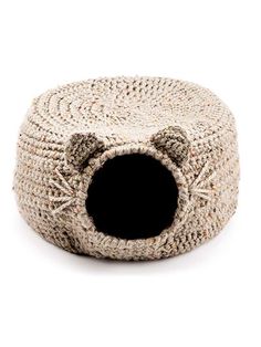 the cat bed is knitted and has a hole in it