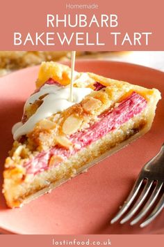 a pink plate with a piece of cake on it and a fork next to it