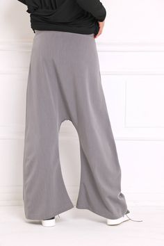 Women Harem Pants, Gray Pants, Drop Crotch Pants Drop crotch sweatpants in wide leg: |KONGO| GARMENT FEATURES: * Clean, minimalistic design * Very low drop crotch silhouette * Wide leg fit * Elasticated * Practical, in-seam side pockets * Made from quality soft sweatshirt jersey COLOUR OPTIONS: This product is available in the following colour options: - black; - ecru; - graphite grey; - light grey; - royal blue. SIZE & FIT: Model is 175cm tall and wears size S. COMPOSITION: Main: 100% cotto Baggy Yoga Trousers For Spring, Casual Baggy Drop Crotch Yoga Pants, Baggy Solid Color Yoga Trousers, Baggy Ankle-length Solid Color Yoga Pants, Baggy Solid Ankle-length Yoga Pants, Casual Baggy Wide Leg Yoga Pants, Baggy Solid Yoga Pants For Spring, Casual Baggy Wide-leg Yoga Pants, Solid Color Baggy Yoga Trousers