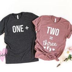 two t - shirts with the words tacos and baby printed on them next to flowers