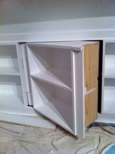 an unfinished cabinet is being built into the wall