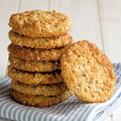 a stack of oatmeal cookies sitting on top of a blue and white towel