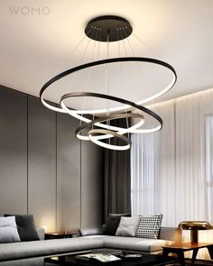 modern living room with circular chandelier and sofa