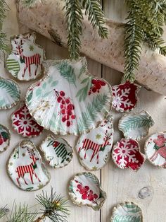 christmas decorations made from shells on a wooden table