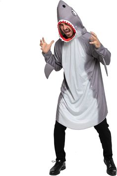 a man dressed in a shark costume with his mouth open and hands out to the side