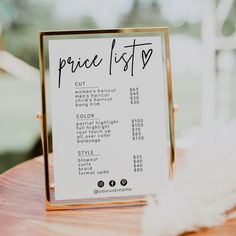 a price list sitting on top of a wooden table