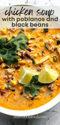 chicken soup with poblaanos and black beans in a white bowl topped with cilantro