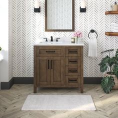 a bathroom with a sink, mirror and plants on the floor in front of it