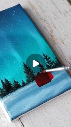 an acrylic painting of trees and the night sky is being used to paint