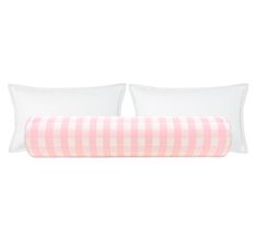 the pink and white checkered bedding is shown with two pillows on each side