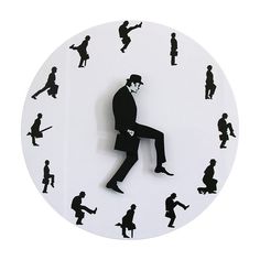 a clock with silhouettes of people on it and a man in a tuxedo