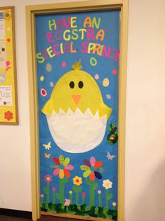 a door decorated with an egg and flowers