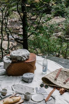 the picnic table is set up with utensils and other items