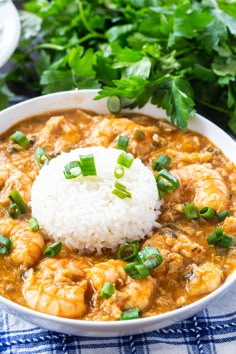 a white bowl filled with shrimp and rice