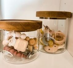 two glass jars filled with different types of items