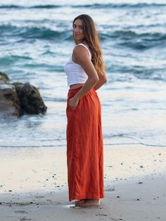 Our boho-chic Catalina Wide Leg Linen Pants are made of 100% linen for breathability and comfort for your next adventures. The wide-leg silhouette adds a touch of sophistication, while the side pockets provide convenient storage for your essentials. Designed with your comfort in mind, these pants feature a double-lined construction to ensure extra coverage and a flattering fit. The elastic ruffled waistband adds a playful touch, while the adjustable tie strings allow you to customize the look to Vacation Wide Leg Full Length Pants With Pockets, Full Length Wide Leg Pants With Pockets For Beach, Bohemian Linen Maxi Skirt For Beach, Bohemian Linen Bottoms With Pockets, Linen Maxi Skirt For Summer Beach, Bohemian Straight Leg Harem Pants For Beach, Vacation Wide-leg Linen Maxi Skirt, Summer Linen Harem Pants With Side Pockets, Full-length Linen Pants For Vacation