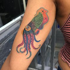 a colorful octopus tattoo on the arm