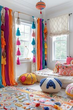 a room filled with lots of colorful tassels and pillows