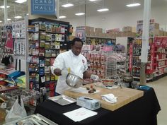 a man is preparing food in a store