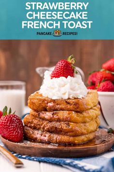 strawberry cheesecake french toast stacked on top of each other with whipped cream and strawberries