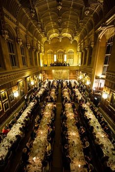 a large dining hall filled with long tables