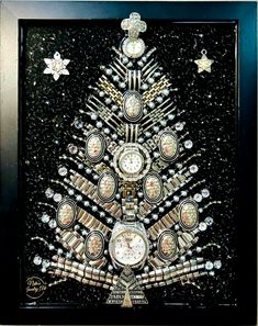 a christmas tree made out of watches and other items is displayed in a black frame