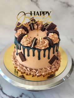 a birthday cake is decorated with chocolate and icing