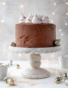 a chocolate cake sitting on top of a white plate