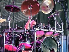 a man playing the drums on stage at a concert