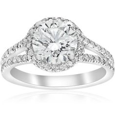 a diamond engagement ring with two rows of diamonds on the band and an oval center stone