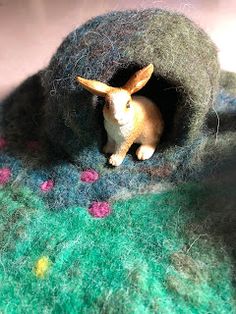 there is a small toy rabbit in the hole