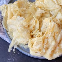 a plate full of potato chips on a table