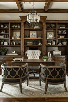 an elegant home office with built in bookcases